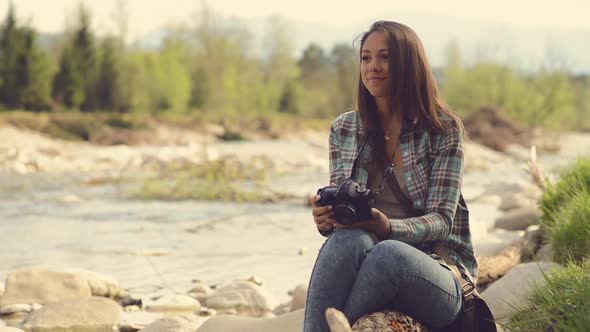 Young girl taking pictures outdoors