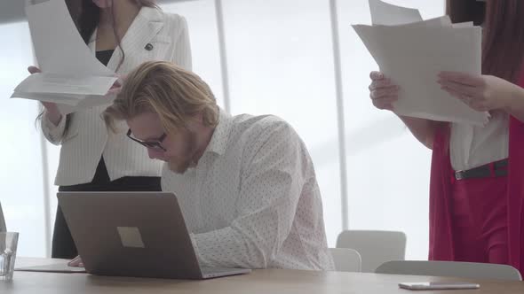 Portrait Successful Busy Businessman in Glasses Sitting in a Light Comfortable Office with Netbook alt