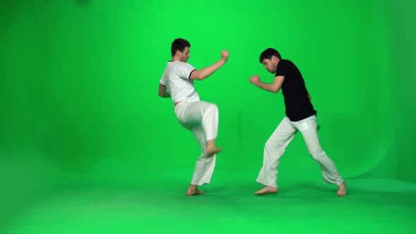 Two Man Are Practicing Capoeira on Chroma Key. Slow Motion. alt