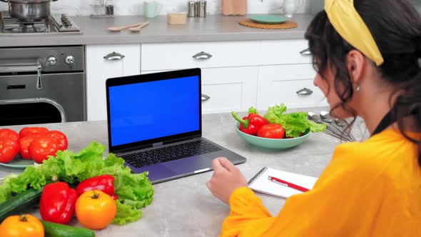 Blue Screen Laptop Woman Watch Online Cooking Course Webinar Tells Teacher Chef alt