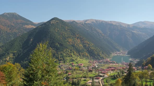 Young Woman on a Swing with the View of the Uzungol Town Near Trabzon Turkey alt