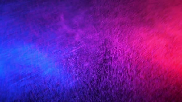 Red and Blue Water Spray Mixed on a Black Background, Slow Motion