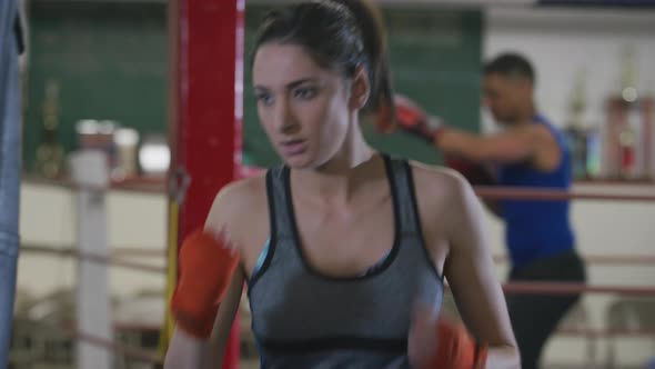 Woman working out at boxing gym