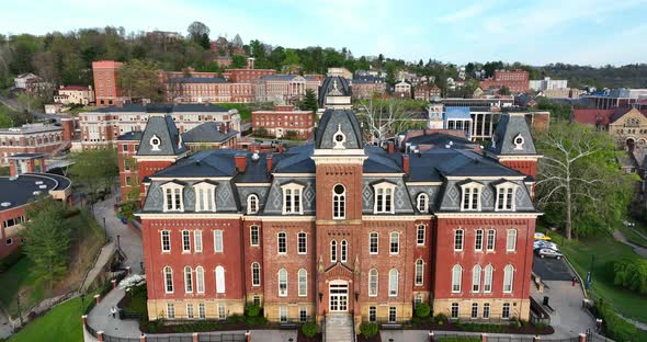 West Virginia University, WVU Woodburn Hall. Rising aerial reveal at golden hour. Public land grant alt