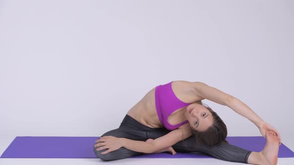 Young Beautiful Multi-ethnic Woman Doing Yoga Pose alt