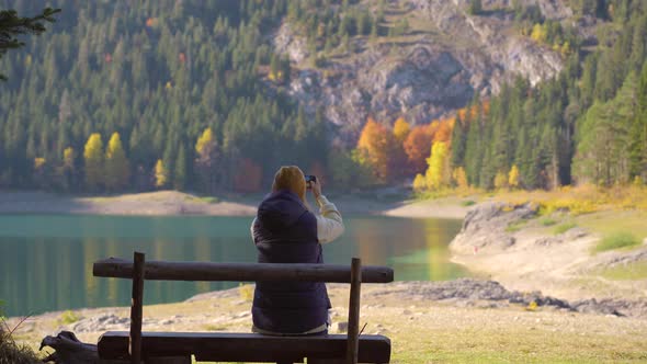 A Young Woman Visits the Crno Jezero or the Black Lake Near the City of Zabljak alt