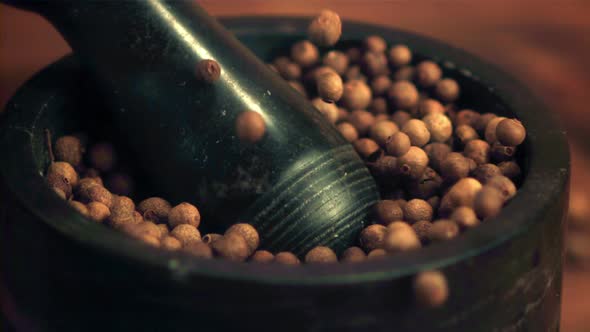 Super Slow Motion in a Mortar with a Pestle Fall Peas of Black Pepper alt