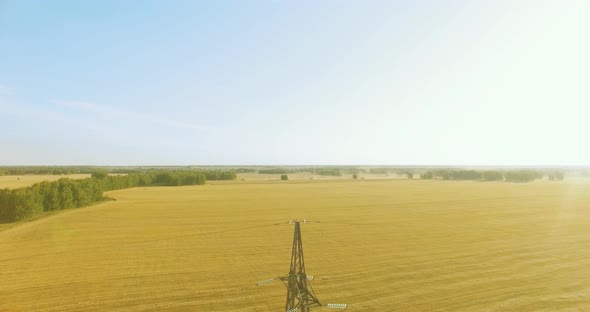Vertical Movement Flight Near High Voltage Electricity Tower and Power Lines at Green and Yellow alt