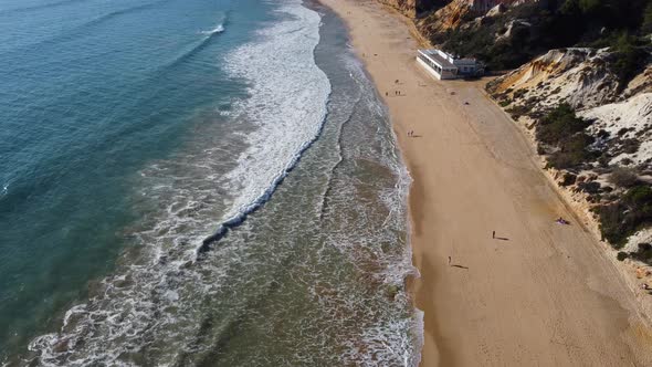 Drone View of Blue Atlantic Ocean and Golden Beach in Portugal