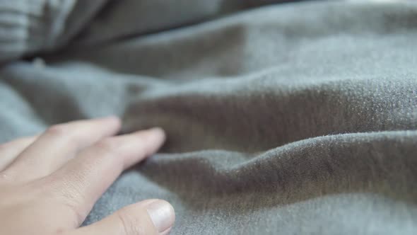 Closeup of Folded Cotton Fabric of Neutral Light Gray Color