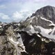 Aerial drone view of different mountain peaks in the spring still with snow. - VideoHive Item for Sale