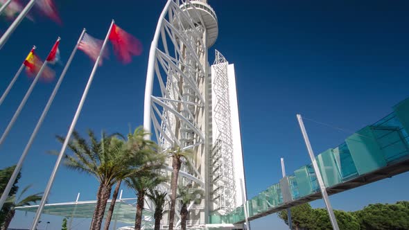 Hotel Tower with Palms and Flags in the Park of the Nations Timelapse Hyperlapse alt