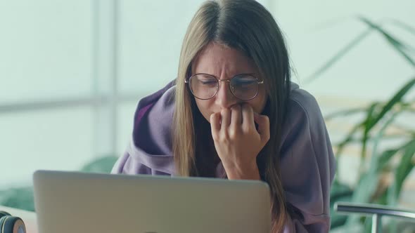 Anxious Sad Woman Looking at Laptop Feeling Frustrated of Bad News alt