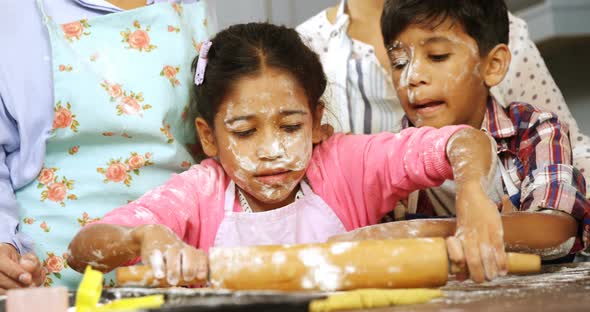 Family preparing cookies in kitchen 4k alt