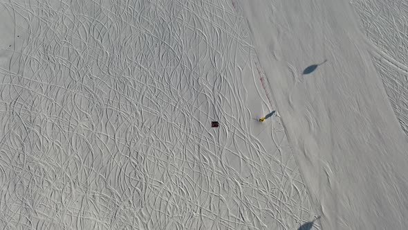 Aerial View Snow Mountain Peak Clouds in Background  Winter Drone Footage Ski Resort alt