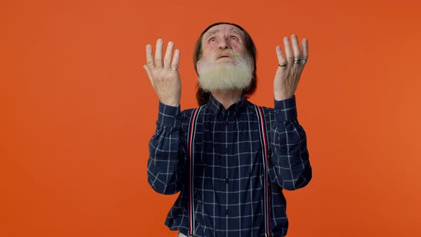Mature Old Man Praying to God Making Wish Asking with Hopeful Imploring Expression Begging Apology alt