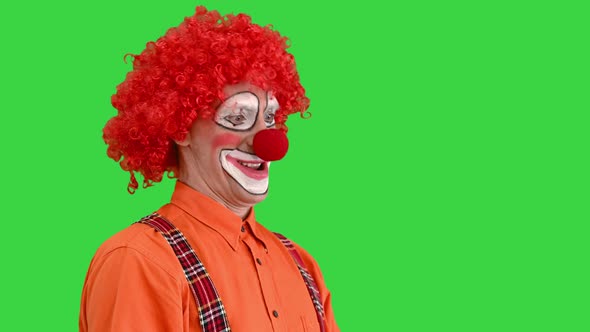 Clown Using Imaginary Digital or Virtual Screen on a Green Screen Chroma Key alt