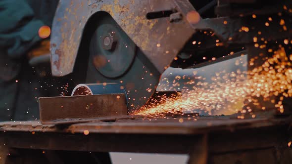 Industrial Worker Grinding Metal with a Lot of Sharp alt