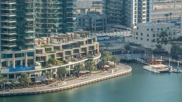 Luxury Dubai Marina Canal with Passing Boats and Promenade Timelapse Dubai United Arab Emirates alt