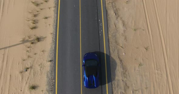 Luxury Car on the Desert Road
