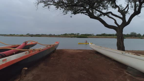 Man paddling kayak in lagoon, Oahu, Hawaii