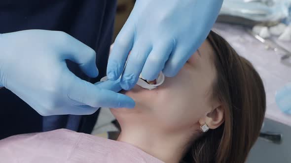 The Dentist Performs the Operation Using Sterile Equipment