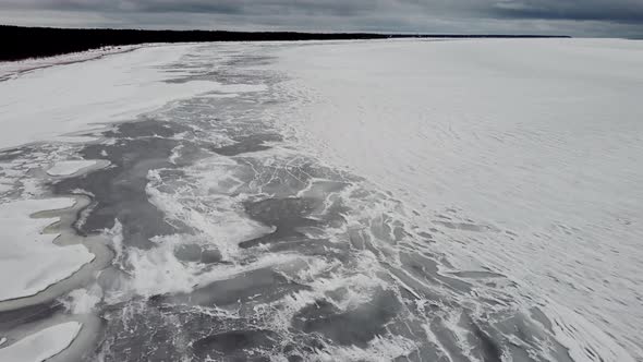 Ice covered sea, frozen waves on run