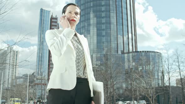 Successful Businesswoman Taking Phone alt