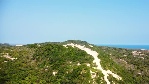 Scenic landscape of white sand dunes on coast of Binh Thuan province, Vietnam, aerial alt