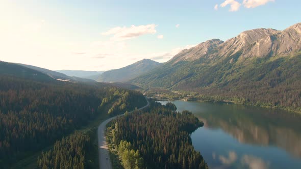 Beautiful, Serene Road View with Mountains, Islands and Lakes alt