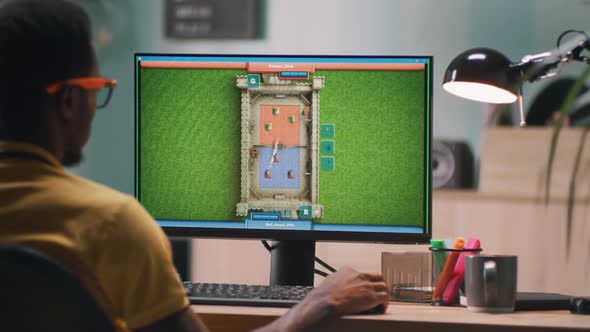 Black Man Playing Videogame on Computer alt