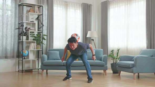 Asian Man Show Skill With Soccer Ball In Living Room, Soccer Freestyle alt