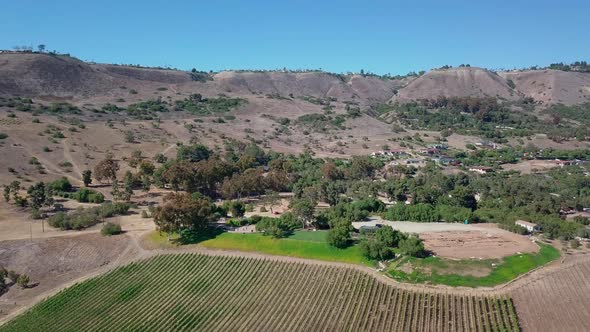 Aerial view of vineyard in rancho palos verdes, United States. Drone flies forward over winery in ma alt