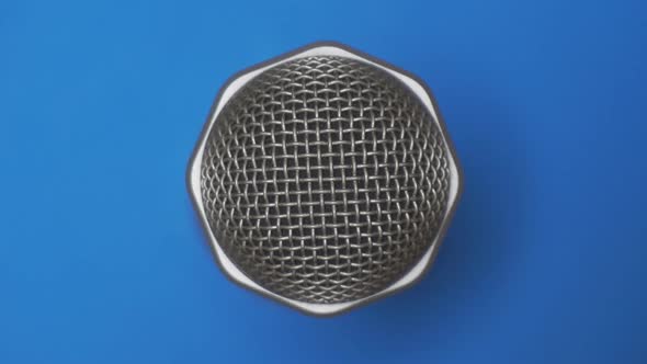Microphone Close Up On A Blue Background