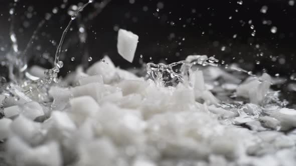 Putting chopped onion on heated non stick fry pan. Slow Motion. alt