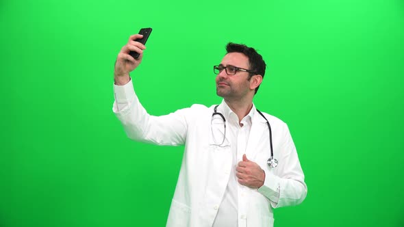 Doctor Taking Selfie on Green Screen alt
