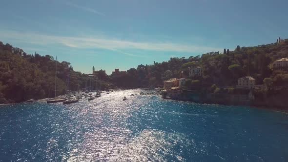 Portofino, Italy, Vessels Move Through Strait Near Coastal Town at Summer Sunny Day alt