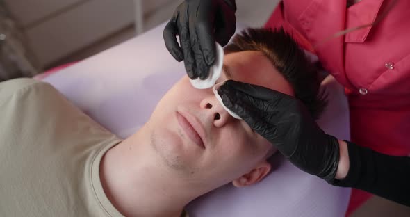 Beautician Wipes a Man's Face with Sponges Face Care at the Beauty Salon  60p Prores HQ alt