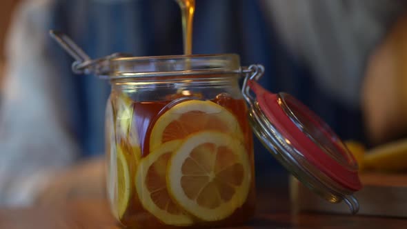 Woman making honey pickled lemon alt