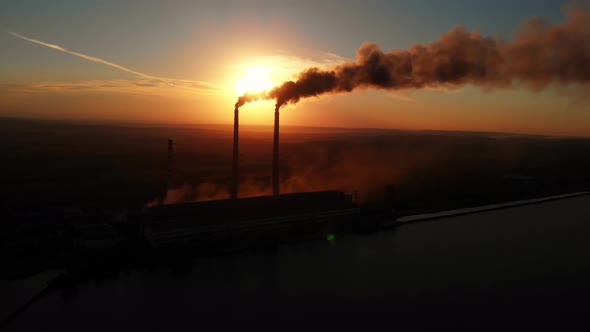 Aerial Drone View: High Chimney Pipes with dirt smoke from Coal Power Plant. alt