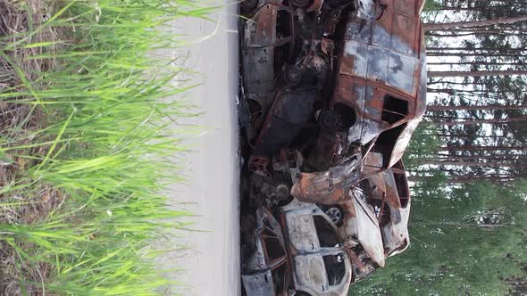 Vertical Video of a Dump of Cars Destroyed By the War in Ukraine alt