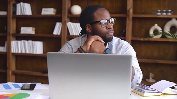 Serious Thoughtful Young African American Guy Thinking of New Ideas alt