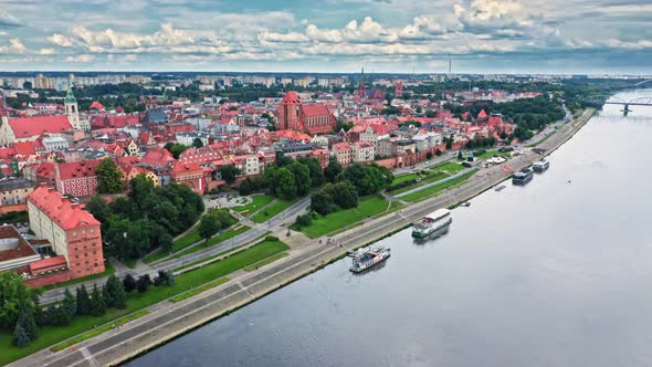 Aerial view of Torun old town and Vistula river. alt