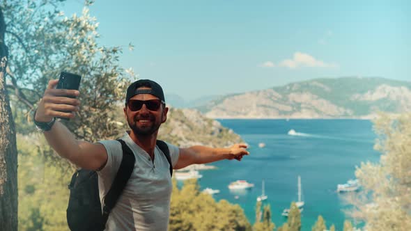 Mobile Phone For Selfie Photo.Selfie On Smartphone In Beautiful Place.Man Taking Picture On Vacation alt