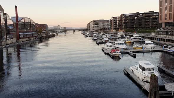 City Centre of Trondheim, Norway in calm evening light. Yachts and boats on the piers in River Nivel alt