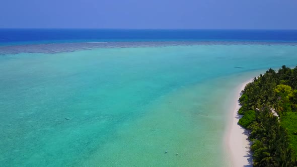 Aerial drone tourism of tropical sea view beach by blue lagoon with sand background alt