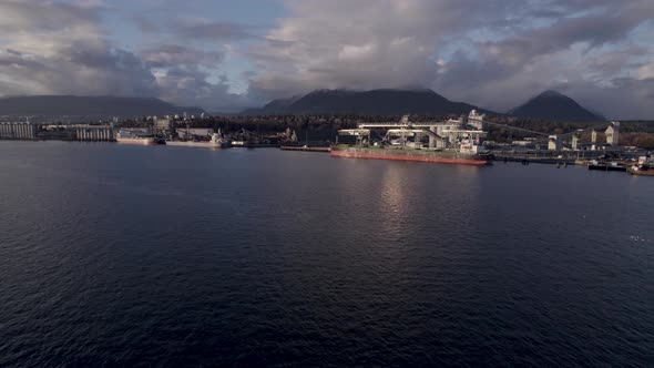 Cargo ships in Vancouver industrial and commercial port, Canada. Aerial drone view alt