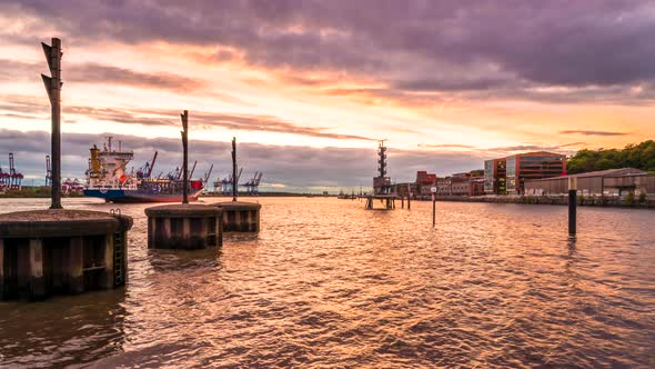 Stunning day to night time lapse of Port of Hamburg and Elbe River with huge container ships passing alt