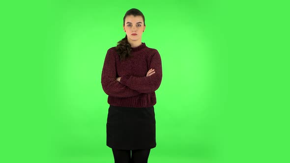 Lovely Girl Is Very Offended and Looks Away Green Screen alt