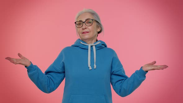 Elderly Woman Raising Hands in Indignant Expression Asking Why What Reason of Failure Irritation alt